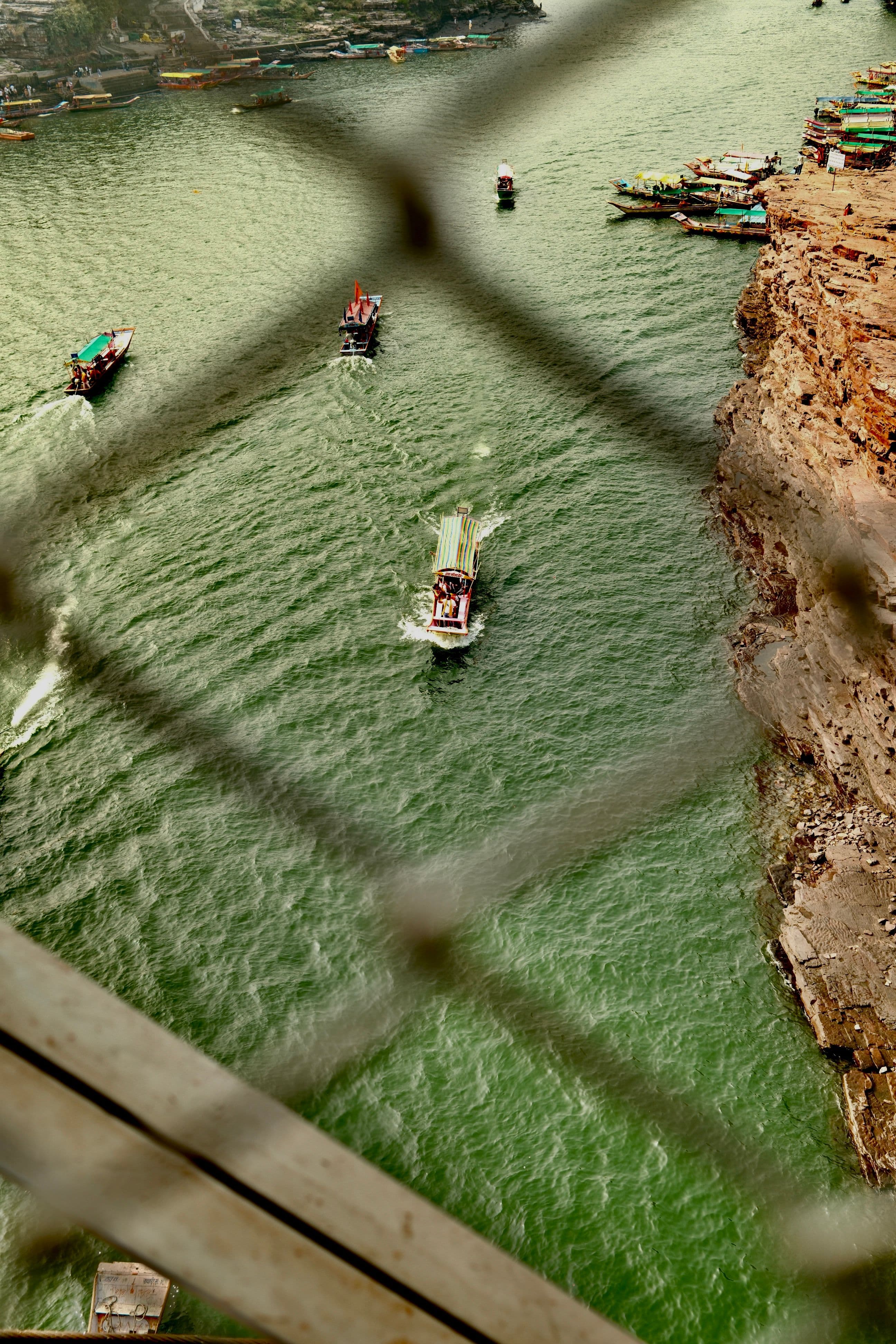 Boats crossing the Narmada River from above, India